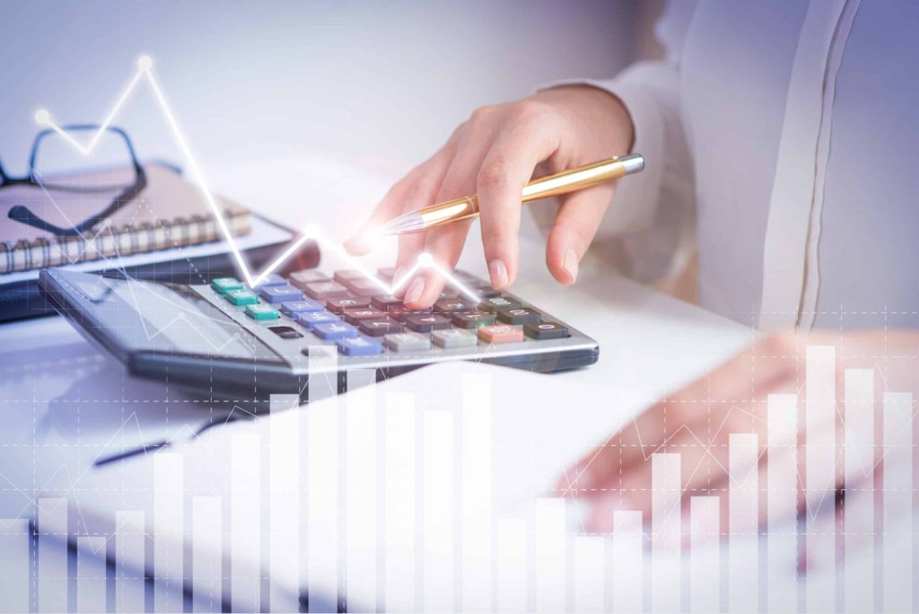 accountant calculating profit with financial analysis graphs scaled 1